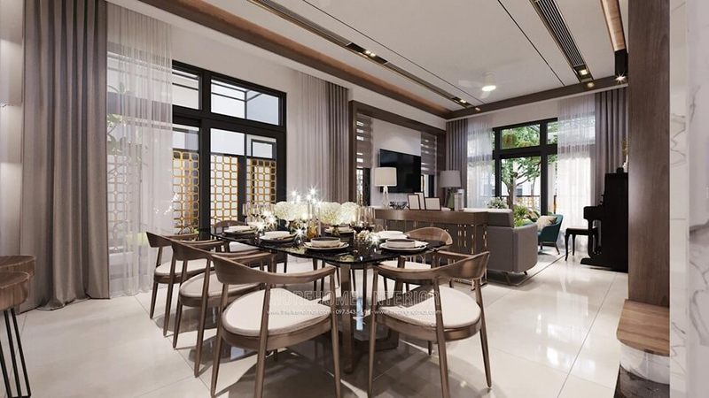 Bộ bàn ghế ăn biệt thự này được thiết kế và sản xuất với sự tinh tế, trau chuốt và sang trọng. Mặt bàn ăn được làm từ đá nhân tạo màu đen, chân bàn là gỗ óc chó nhập khẩu cao cấp. Còn 8 chiếc ghế ăn gỗ óc chó được bọc đệm da màu kem, kết nối với nhau tạo thành chiếc áo choàng bao quanh chiếc bàn ăn hiện đại.